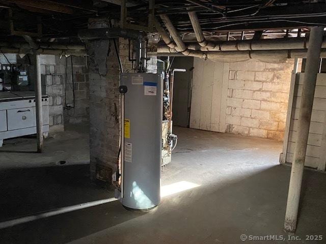 242 Pearl St, Enfield, CT 06082 - unfinished basement featuring water heater