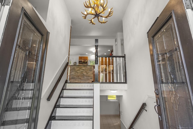 408 Stage Coach Rd, Durham, CT 06422 - stairs with a chandelier and tile patterned flooring