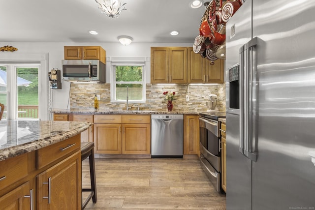 408 Stage Coach Rd, Durham, CT 06422 - kitchen with appliances with stainless steel finishes, plenty of natural light, brown cabinets, and recessed lighting