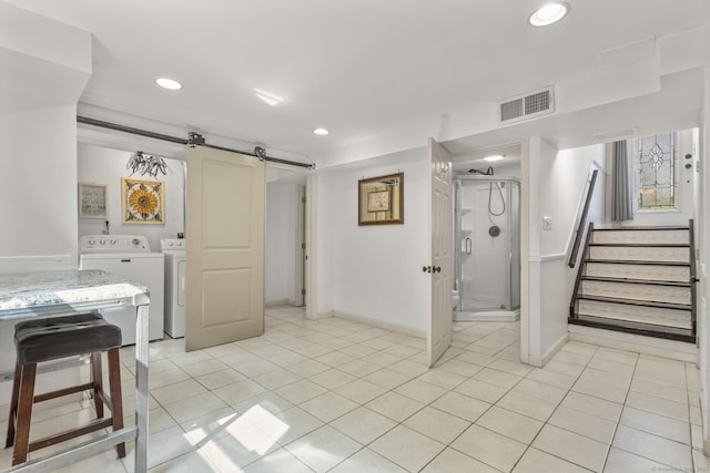 408 Stage Coach Rd, Durham, CT 06422 - kitchen featuring independent washer and dryer, a barn door, recessed lighting, light tile patterned flooring, and light countertops