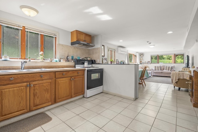 408 Stage Coach Rd, Durham, CT 06422 - kitchen with range with electric cooktop, under cabinet range hood, backsplash, open floor plan, and brown cabinets
