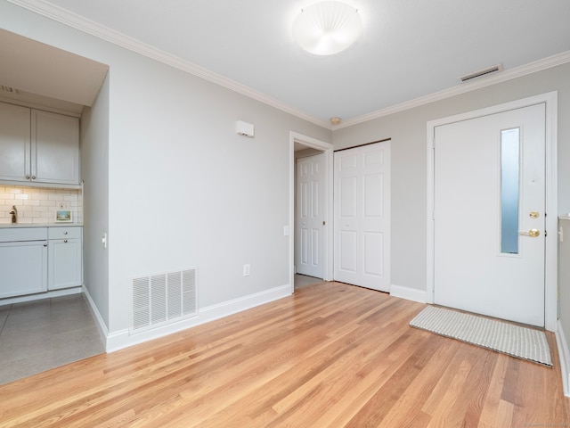 3 Orange Ln Unit 3, Ridgefield, CT 06877 - entrance foyer with crown molding and light wood-type flooring