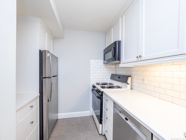 3 Orange Ln Unit 3, Ridgefield, CT 06877 - kitchen featuring stainless steel appliances, white cabinets, decorative backsplash, light countertops, and light tile patterned floors