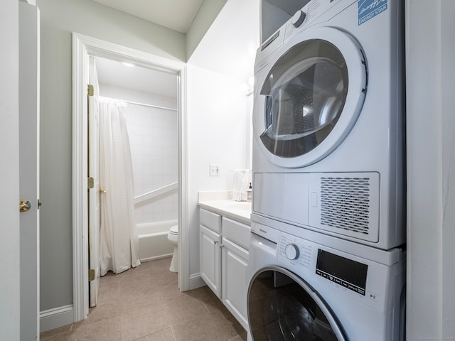 3 Orange Ln Unit 3, Ridgefield, CT 06877 - washroom with estacked washer and dryer and light tile patterned floors