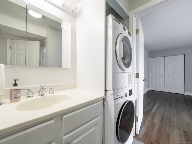 3 Orange Ln Unit 3, Ridgefield, CT 06877 - washroom featuring stacked washer / drying machine and dark wood-type flooring