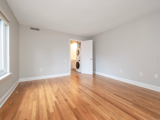 3 Orange Ln Unit 3, Ridgefield, CT 06877 - spare room with estacked washer and dryer, light wood-type flooring, and plenty of natural light