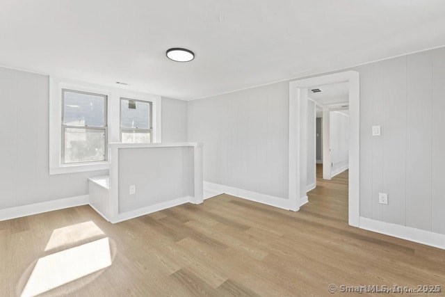 25 W Coit St, New London, CT 06320 - spare room featuring wood finished floors and baseboards