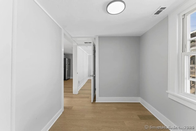 25 W Coit St, New London, CT 06320 - corridor with baseboards and wood finished floors