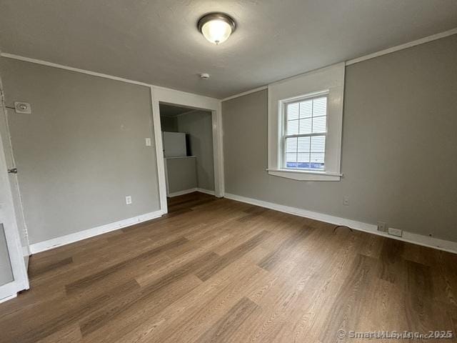 25 W Coit St, New London, CT 06320 - unfurnished bedroom with wood finished floors and baseboards