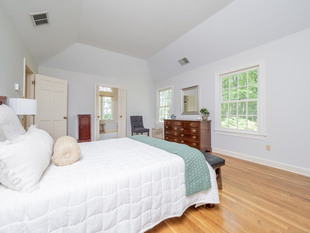 104 Scarlet Oak Dr, Wilton, CT 06897 - bedroom featuring multiple windows, radiator, light wood-style floors, vaulted ceiling, and baseboards