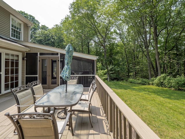 104 Scarlet Oak Dr, Wilton, CT 06897 - deck featuring a sunroom, outdoor dining space, a lawn, and view of wooded area