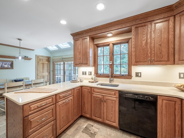 104 Scarlet Oak Dr, Wilton, CT 06897 - kitchen featuring black dishwasher, a sink, a peninsula, a skylight, and light countertops