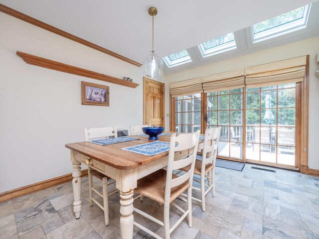 104 Scarlet Oak Dr, Wilton, CT 06897 - dining area with a skylight, stone tile floors, baseboards, and crown molding