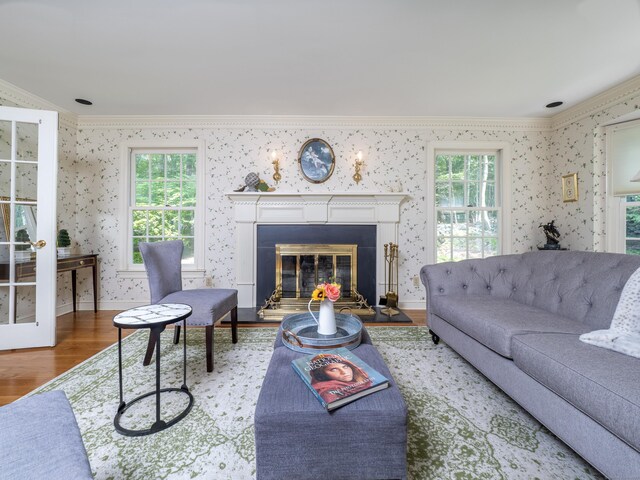 104 Scarlet Oak Dr, Wilton, CT 06897 - living area with ornamental molding, wallpapered walls, wood finished floors, a glass covered fireplace, and baseboards