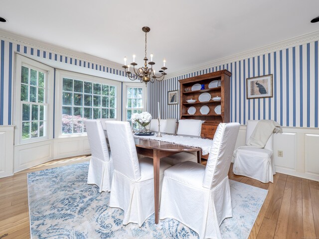 104 Scarlet Oak Dr, Wilton, CT 06897 - dining room with a chandelier, a decorative wall, wallpapered walls, light wood-style flooring, and wainscoting