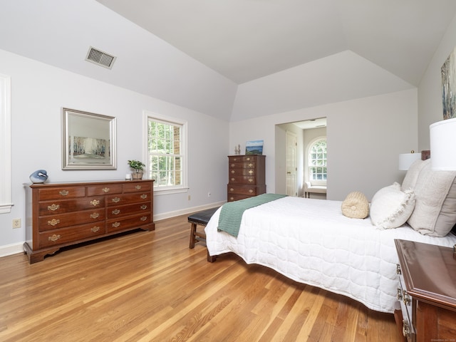 104 Scarlet Oak Dr, Wilton, CT 06897 - bedroom with light wood-type flooring, vaulted ceiling, and baseboards