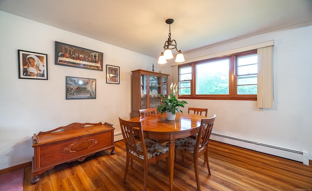895 W Woods Rd, Hamden, CT 06518 - dining area featuring a baseboard radiator and wood finished floors