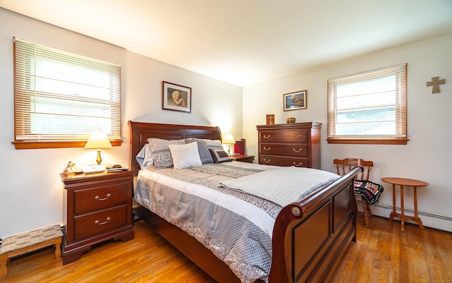 895 W Woods Rd, Hamden, CT 06518 - bedroom with light wood finished floors and baseboard heating