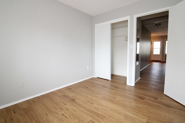 63 Niles Hill Rd Unit A4, New London, CT 06320 - unfurnished bedroom featuring light wood finished floors, a closet, and baseboards