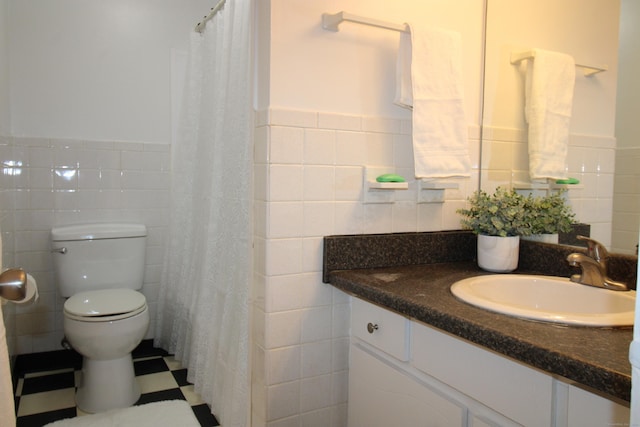 63 Niles Hill Rd Unit A4, New London, CT 06320 - full bathroom featuring tile walls, vanity, toilet, a wainscoted wall, and a shower with shower curtain