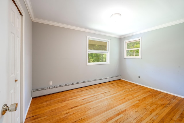46 Columbine Dr, Trumbull, CT 06611 - empty room with a baseboard heating unit, hardwood / wood-style flooring, crown molding, and baseboards