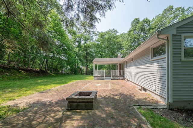 46 Columbine Dr, Trumbull, CT 06611 - view of grassy yard with a fire pit, a patio, and a wooden deck