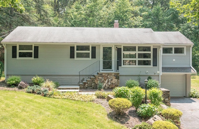 46 Columbine Dr, Trumbull, CT 06611 - ranch-style home with a chimney, an attached garage, asphalt driveway, a front yard, and a shingled roof