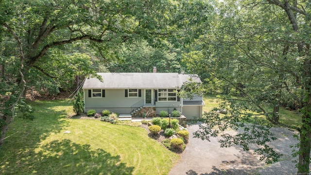 46 Columbine Dr, Trumbull, CT 06611 - view of front of house featuring a front lawn, a chimney, and a view of trees