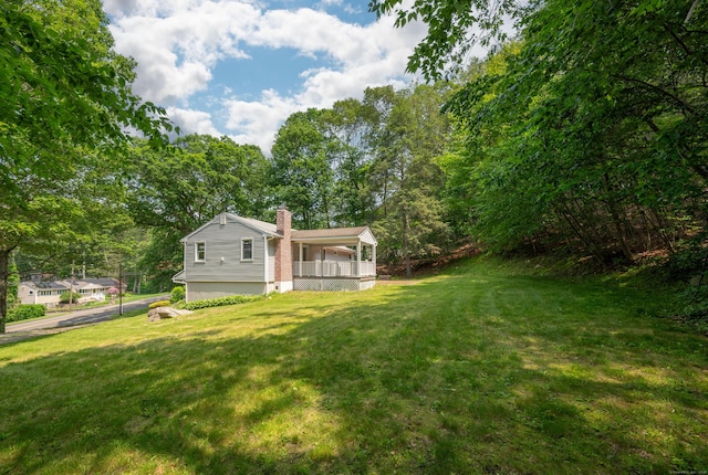 46 Columbine Dr, Trumbull, CT 06611 - view of grassy yard featuring a porch