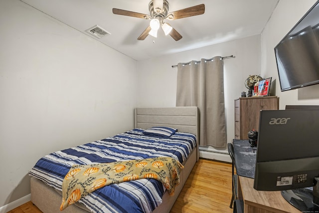 7 Pleasant St, Wolcott, CT 06716 - bedroom with wood finished floors, baseboard heating, and ceiling fan