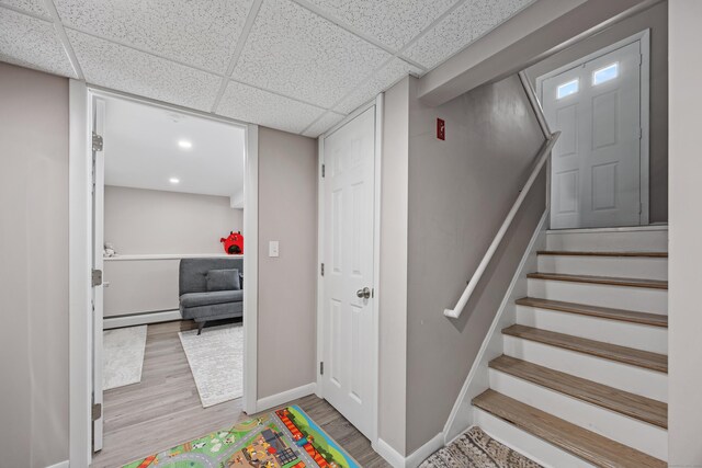 7 Pleasant St, Wolcott, CT 06716 - staircase with a baseboard radiator and wood finished floors