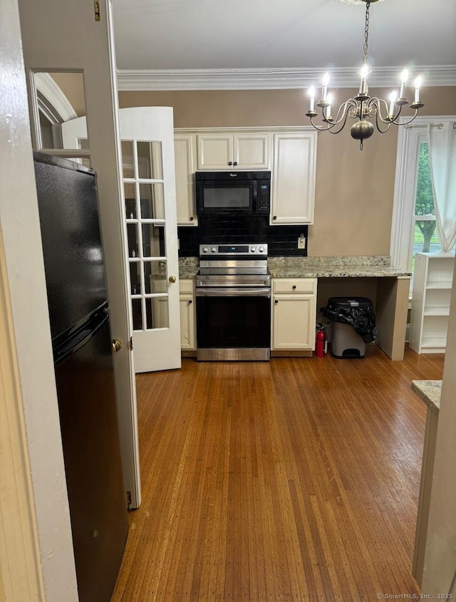 201 Center St, West Haven, CT 06516 - kitchen featuring black appliances, a chandelier, ornamental molding, white cabinetry, and backsplash