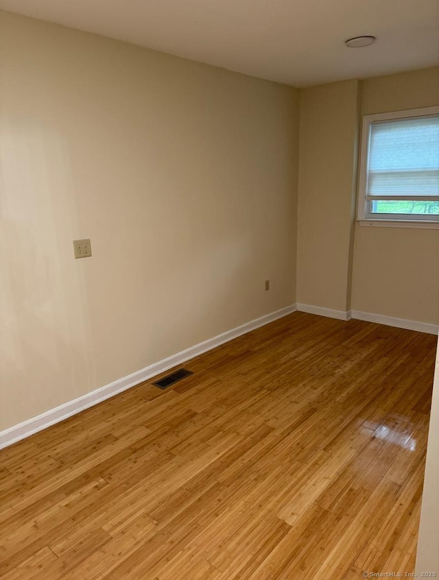 201 Center St, West Haven, CT 06516 - unfurnished room featuring light wood-style floors and baseboards