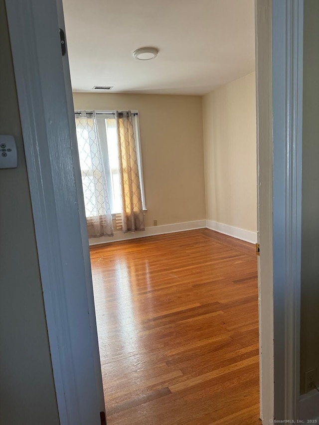 201 Center St, West Haven, CT 06516 - unfurnished room featuring wood finished floors and baseboards