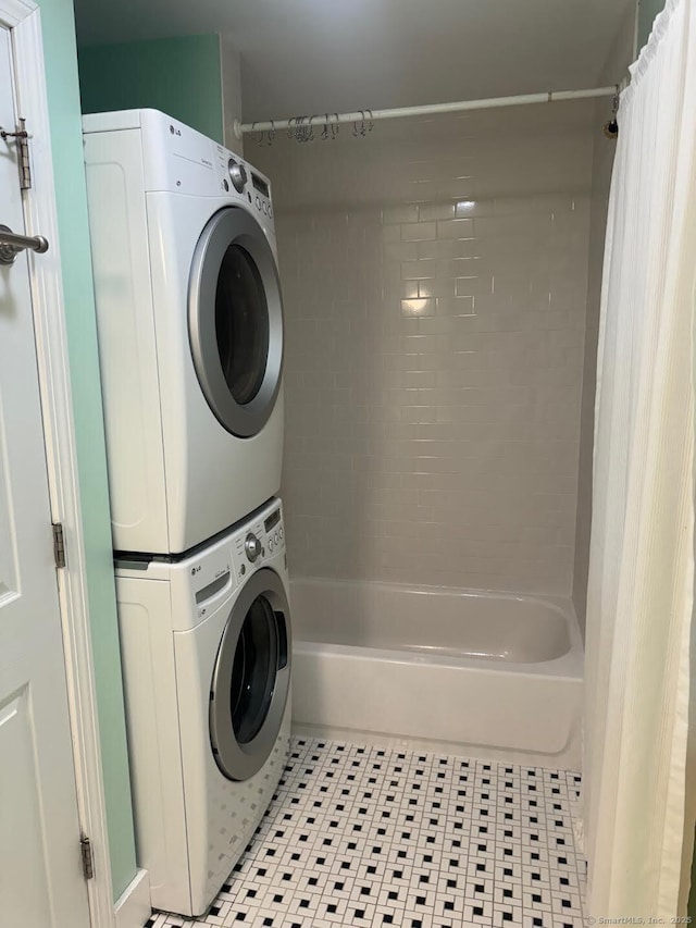 201 Center St, West Haven, CT 06516 - laundry room with estacked washer and dryer and light tile patterned floors
