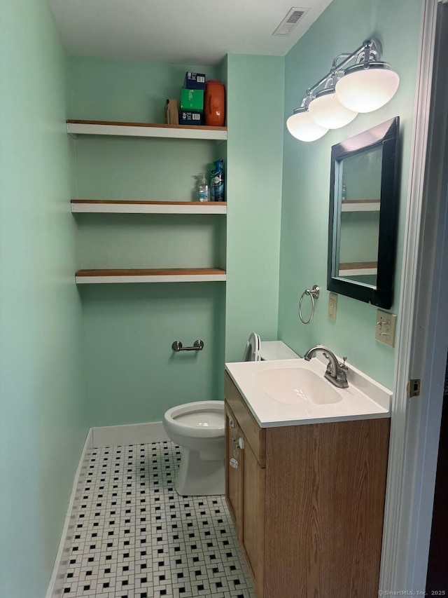 201 Center St, West Haven, CT 06516 - half bath featuring vanity, toilet, and tile patterned flooring