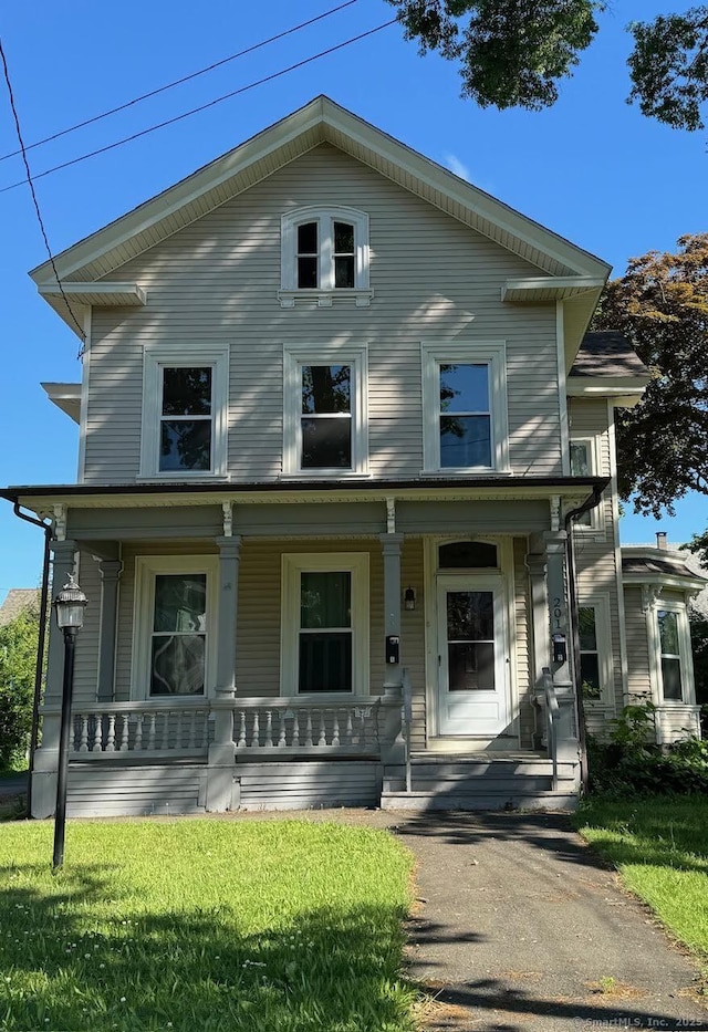 201 Center St, West Haven, CT 06516 - view of front of property with covered porch and a front yard