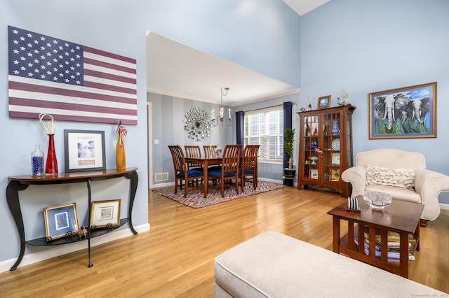 14 Linden Hts Unit 14, Norwalk, CT 06851 - living room featuring wood finished floors, a chandelier, and a high ceiling