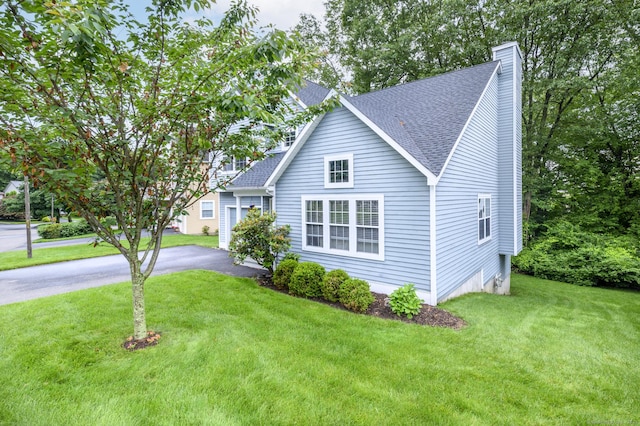 14 Linden Hts Unit 14, Norwalk, CT 06851 - view of front facade featuring a shingled roof, a chimney, a front lawn, and asphalt driveway