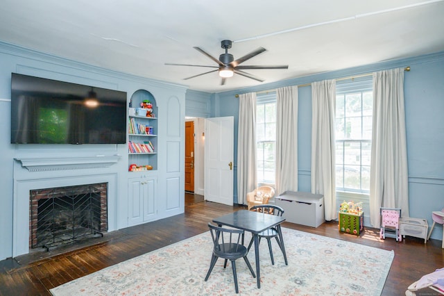 189 Broadway, Norwich, CT 06360 - living room with ceiling fan, wood finished floors, a fireplace, and crown molding