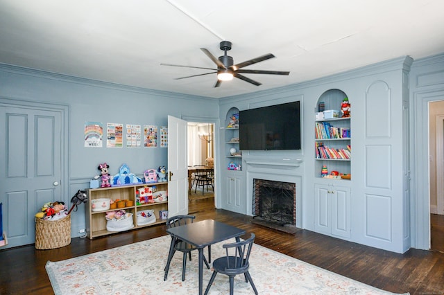 189 Broadway, Norwich, CT 06360 - living area with a ceiling fan, wood finished floors, crown molding, built in features, and a fireplace