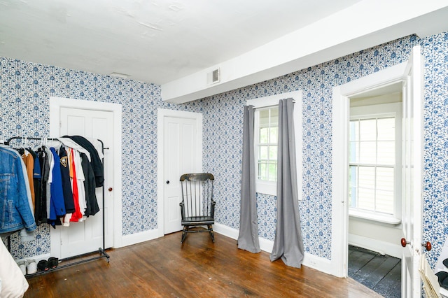 189 Broadway, Norwich, CT 06360 - unfurnished bedroom with wood finished floors and wallpapered walls