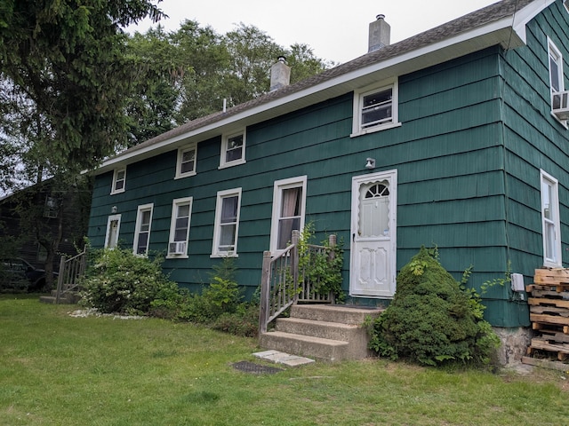 52 Sheldon Rd, Griswold, CT 06351 - view of front of house with a chimney and a front lawn