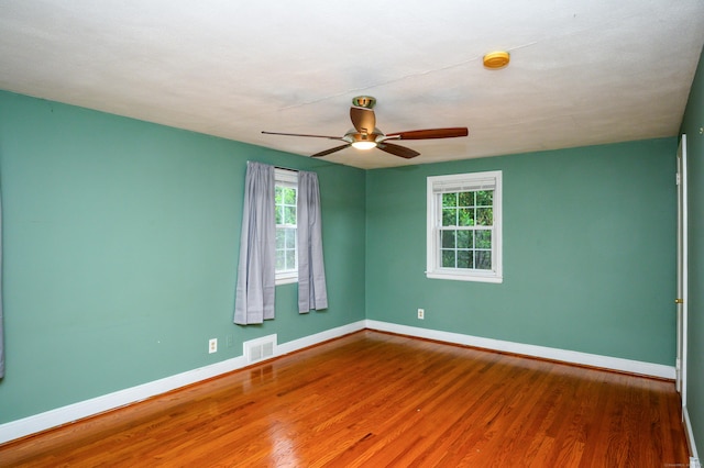 60 Old Mill Rd, Middletown, CT 06457 - unfurnished room with wood finished floors, healthy amount of natural light, ceiling fan, and a smoke detector