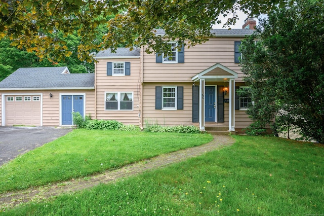 60 Old Mill Rd, Middletown, CT 06457 - view of front of property with an attached garage, a front lawn, driveway, a chimney, and a shingled roof