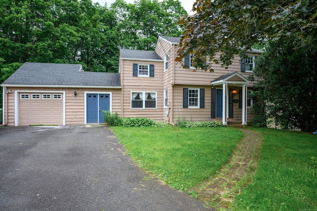 60 Old Mill Rd, Middletown, CT 06457 - view of front of house with an attached garage, asphalt driveway, a front lawn, and roof with shingles