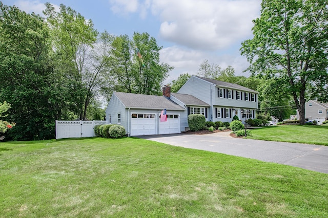 320 Spruce St, Cheshire, CT 06410 - colonial home with driveway, a garage, and a chimney