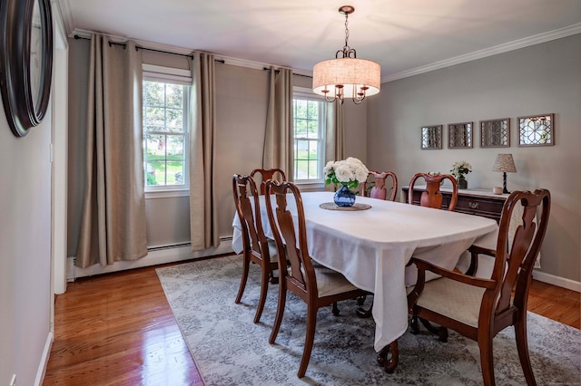 320 Spruce St, Cheshire, CT 06410 - dining area featuring plenty of natural light, wood finished floors, ornamental molding, a chandelier, and a baseboard radiator