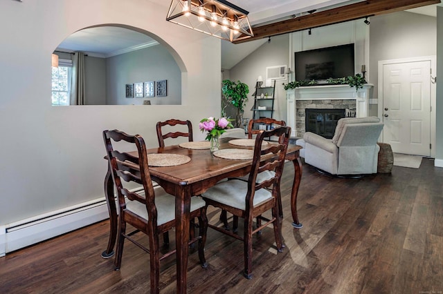 320 Spruce St, Cheshire, CT 06410 - dining space featuring wood finished floors, a baseboard heating unit, a fireplace, arched walkways, and crown molding