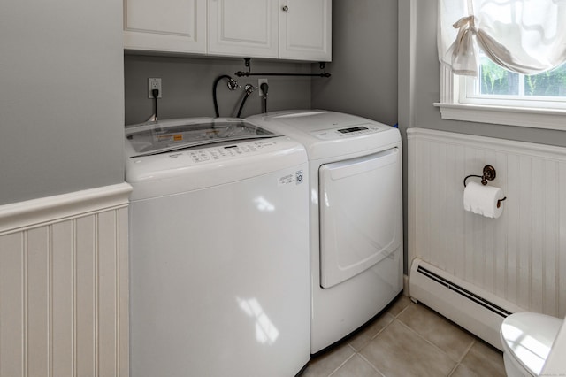 320 Spruce St, Cheshire, CT 06410 - laundry area featuring a baseboard heating unit, washer and dryer, a wainscoted wall, light tile patterned floors, and cabinet space